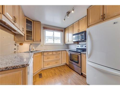 69-120 Quigley Road, Hamilton, ON - Indoor Photo Showing Kitchen With Stainless Steel Kitchen With Double Sink