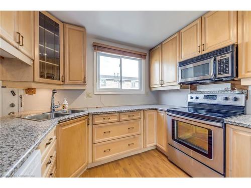 69-120 Quigley Road, Hamilton, ON - Indoor Photo Showing Kitchen With Stainless Steel Kitchen With Double Sink