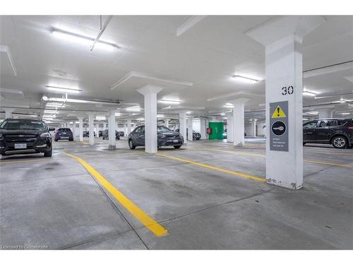 906-2391 Central Park Drive, Oakville, ON - Indoor Photo Showing Garage