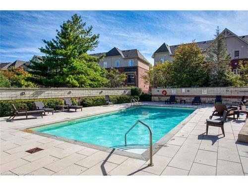 906-2391 Central Park Drive, Oakville, ON - Outdoor With In Ground Pool With Backyard