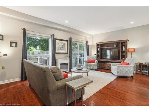 16-218 Plains Road E, Burlington, ON - Indoor Photo Showing Living Room With Fireplace