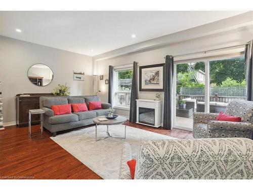 16-218 Plains Road E, Burlington, ON - Indoor Photo Showing Living Room With Fireplace