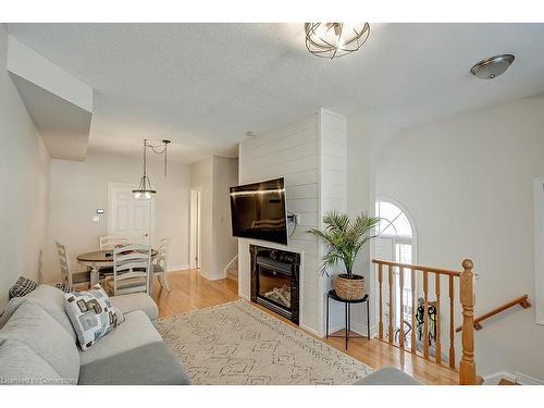 59-1169 Dorval Drive, Oakville, ON - Indoor Photo Showing Living Room With Fireplace