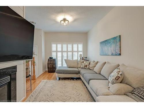 59-1169 Dorval Drive, Oakville, ON - Indoor Photo Showing Living Room With Fireplace