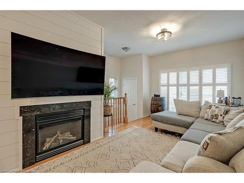 59-1169 Dorval Drive, Oakville, ON - Indoor Photo Showing Living Room With Fireplace