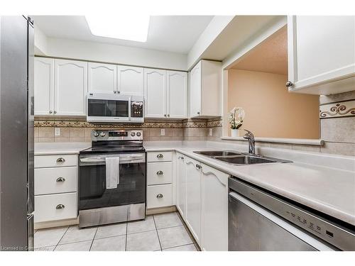 1310-100 Burloak Drive, Burlington, ON - Indoor Photo Showing Kitchen With Double Sink