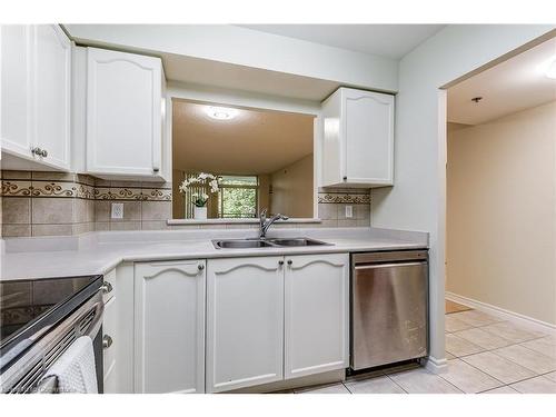 1310-100 Burloak Drive, Burlington, ON - Indoor Photo Showing Kitchen With Double Sink