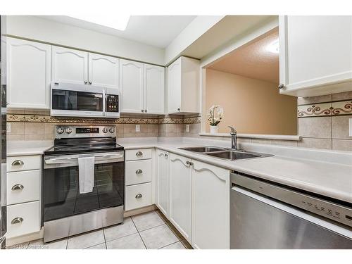 1310-100 Burloak Drive, Burlington, ON - Indoor Photo Showing Kitchen With Double Sink