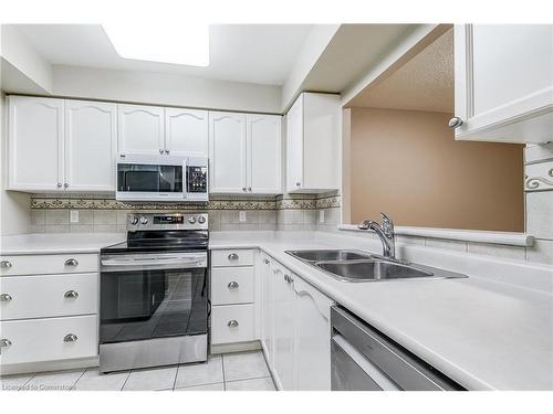 1310-100 Burloak Drive, Burlington, ON - Indoor Photo Showing Kitchen With Double Sink