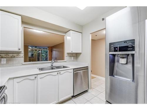 1310-100 Burloak Drive, Burlington, ON - Indoor Photo Showing Kitchen With Double Sink