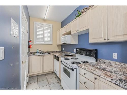 301-1441 Walker'S Line, Burlington, ON - Indoor Photo Showing Kitchen With Double Sink