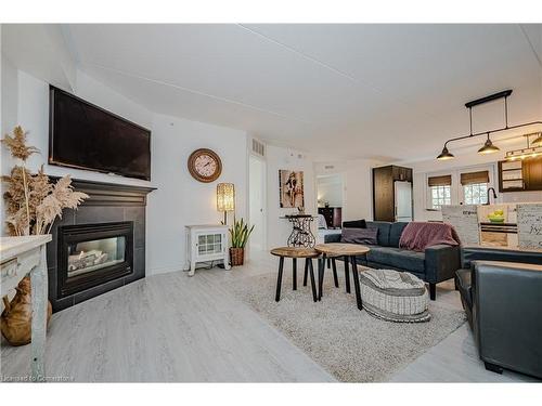 301-1441 Walker'S Line, Burlington, ON - Indoor Photo Showing Living Room With Fireplace