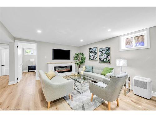 66 Howe Avenue, Hamilton, ON - Indoor Photo Showing Living Room With Fireplace