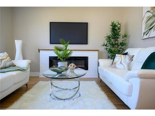 66 Howe Avenue, Hamilton, ON - Indoor Photo Showing Living Room With Fireplace