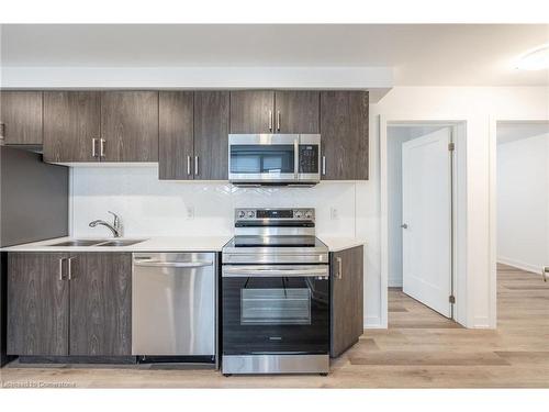 214-4263 Fourth Avenue, Niagara Falls, ON - Indoor Photo Showing Kitchen With Double Sink