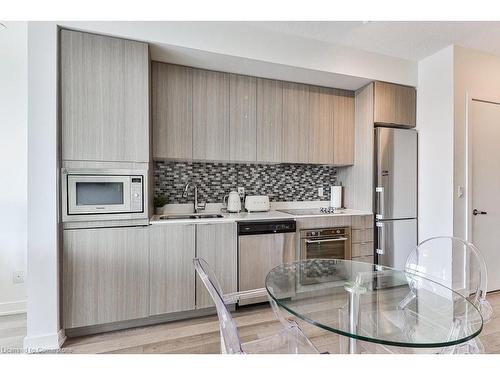 A527-5230 Dundas Street, Burlington, ON - Indoor Photo Showing Kitchen With Double Sink