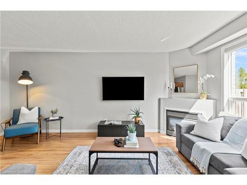 12-134 Terni Boulevard, Hamilton, ON - Indoor Photo Showing Living Room With Fireplace