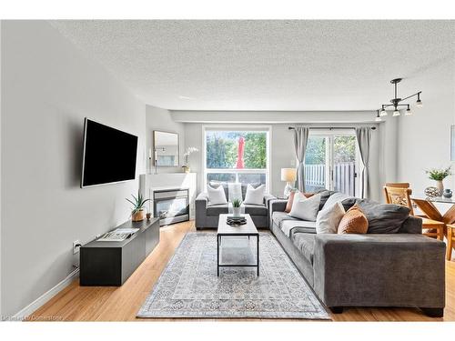 12-134 Terni Boulevard, Hamilton, ON - Indoor Photo Showing Living Room With Fireplace