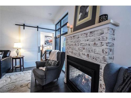 Ph412-38 Harbour Street, Port Dover, ON - Indoor Photo Showing Living Room With Fireplace