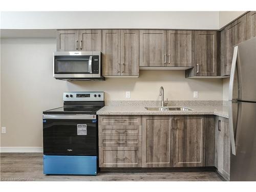 B-183 Rykert Street, St. Catharines, ON - Indoor Photo Showing Kitchen With Double Sink