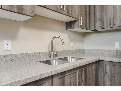 B-183 Rykert Street, St. Catharines, ON - Indoor Photo Showing Kitchen With Double Sink