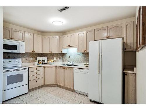 410-2085 Amherst Heights Drive, Burlington, ON - Indoor Photo Showing Kitchen With Double Sink