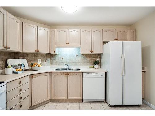 410-2085 Amherst Heights Drive, Burlington, ON - Indoor Photo Showing Kitchen With Double Sink