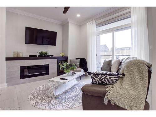 102-257 Millen Road, Stoney Creek, ON - Indoor Photo Showing Living Room With Fireplace