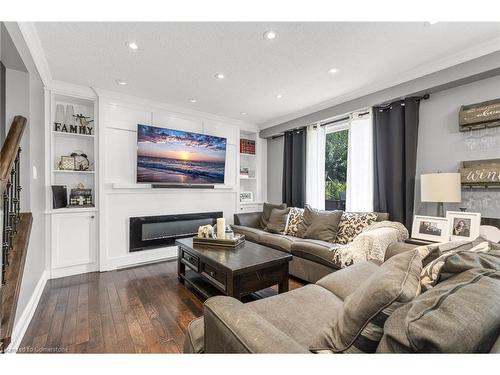 65 Memorial Avenue, Stoney Creek, ON - Indoor Photo Showing Living Room With Fireplace