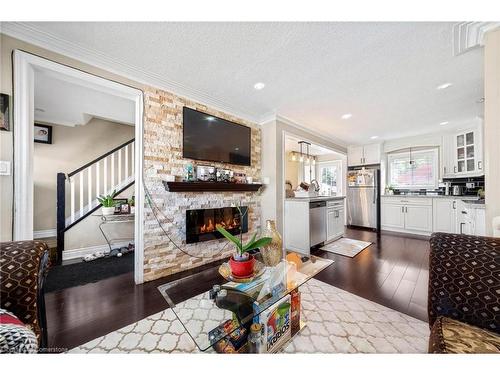 118 Barons Avenue N, Hamilton, ON - Indoor Photo Showing Living Room With Fireplace