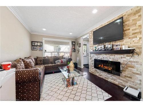 118 Barons Avenue N, Hamilton, ON - Indoor Photo Showing Living Room With Fireplace