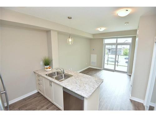 214-101 Shoreview Place, Stoney Creek, ON - Indoor Photo Showing Kitchen With Double Sink