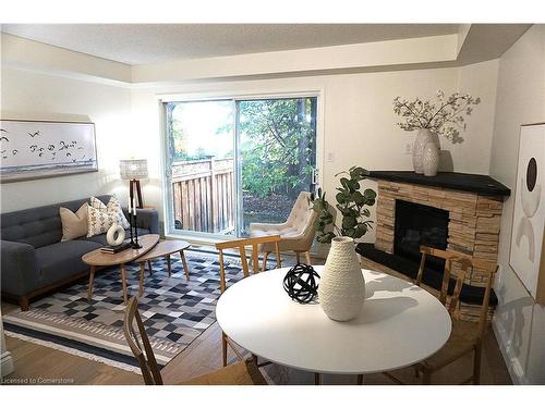 23-2015 Cleaver Avenue, Burlington, ON - Indoor Photo Showing Living Room With Fireplace