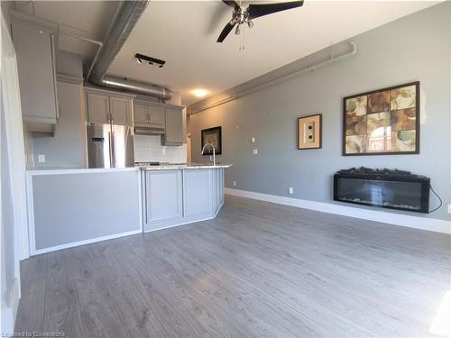 412-150 Colborne Street, Brantford, ON - Indoor Photo Showing Kitchen With Fireplace