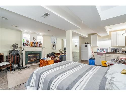 4206 Stadelbauer Drive, Beamsville, ON - Indoor Photo Showing Bedroom With Fireplace