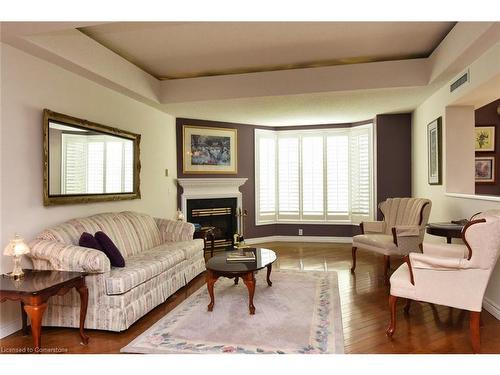 309-980 Golf Links Road, Ancaster, ON - Indoor Photo Showing Living Room With Fireplace