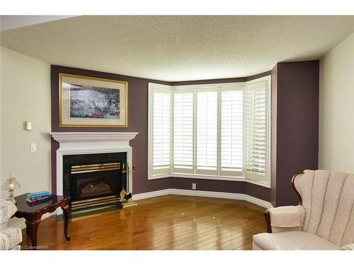 309-980 Golf Links Road, Ancaster, ON - Indoor Photo Showing Living Room With Fireplace