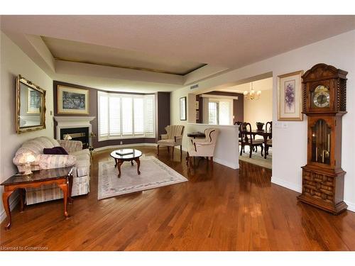 309-980 Golf Links Road, Ancaster, ON - Indoor Photo Showing Living Room With Fireplace