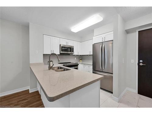 709-30 Grand Trunk Crescent, Toronto, ON - Indoor Photo Showing Kitchen With Double Sink