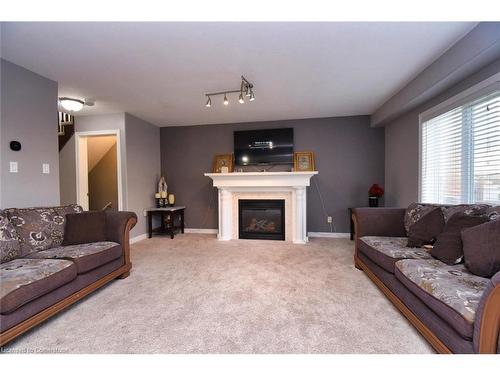 30 Newlove Street, Hamilton, ON - Indoor Photo Showing Living Room With Fireplace