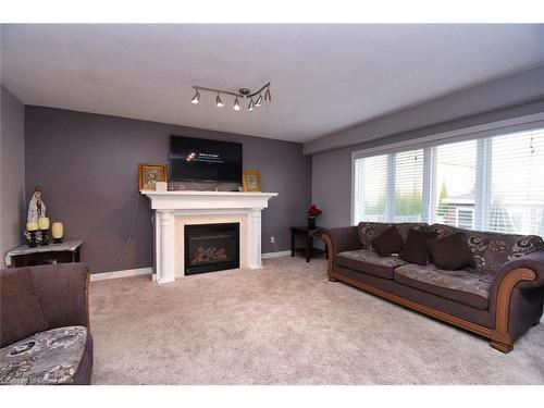 30 Newlove Street, Hamilton, ON - Indoor Photo Showing Living Room With Fireplace