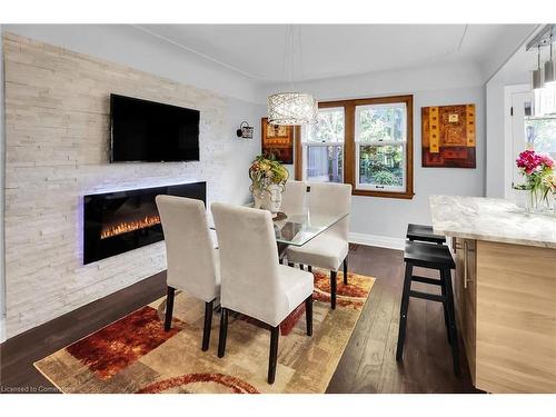 65 London Street S, Hamilton, ON - Indoor Photo Showing Dining Room With Fireplace