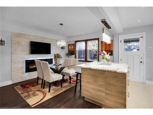 65 London Street S, Hamilton, ON - Indoor Photo Showing Dining Room With Fireplace