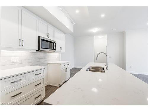 101-1880 Gordon Street, Guelph, ON - Indoor Photo Showing Kitchen With Double Sink