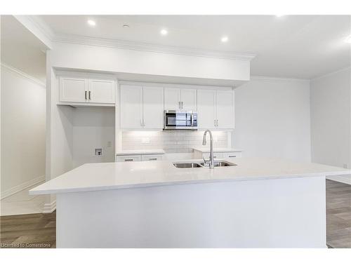 101-1880 Gordon Street, Guelph, ON - Indoor Photo Showing Kitchen With Double Sink