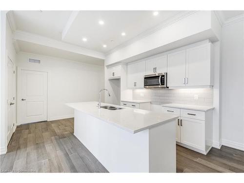 101-1880 Gordon Street, Guelph, ON - Indoor Photo Showing Kitchen With Double Sink