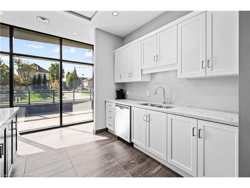 111-30 Hamilton Street S, Waterdown, ON - Indoor Photo Showing Kitchen With Double Sink