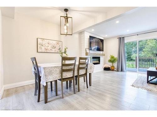 16-125 Livingston Avenue, Grimsby, ON - Indoor Photo Showing Dining Room With Fireplace