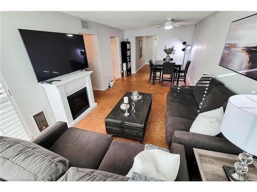 108-1225 North Shore Boulevard E, Burlington, ON - Indoor Photo Showing Living Room With Fireplace