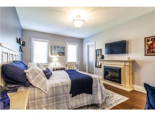 72 Pond View Gate, Waterdown, ON - Indoor Photo Showing Bedroom With Fireplace